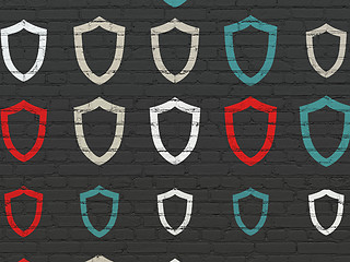 Image showing Security concept: Contoured Shield icons on wall background