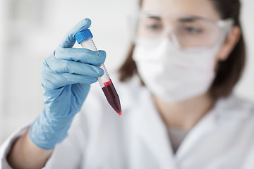 Image showing close up of scientist with tube making test in lab