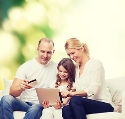 Image showing happy family with tablet pc and credit card