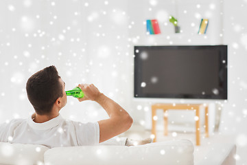 Image showing man watching tv and drinking beer at home