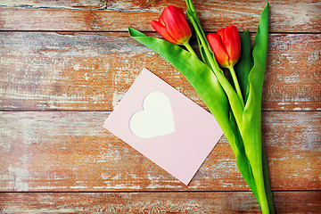 Image showing close up of tulips and greeting card with heart