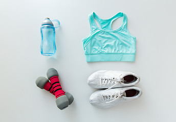 Image showing close up of sportswear, dumbbells and bottle