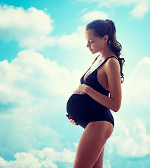 Image showing happy pregnant woman in black underwear