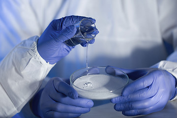 Image showing close up of scientists hands with chemicals in lab