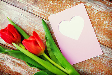 Image showing close up of tulips and greeting card with heart