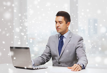 Image showing businessman working with laptop in office