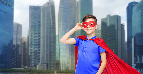 Image showing boy in red super hero cape and mask