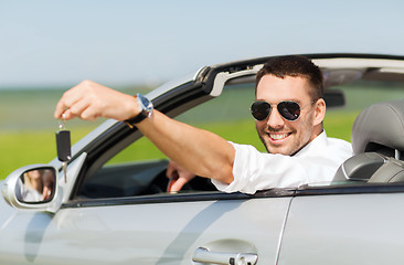 Image showing happy man in cabriolet showing car key