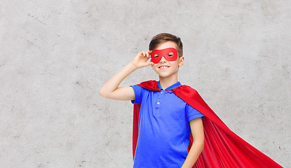 Image showing boy in red superhero cape and mask