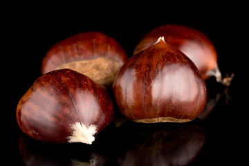 Image showing Chestnuts on a black reflective background