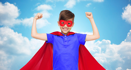 Image showing boy in red super hero cape and mask showing fists