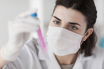 Image showing close up of scientist with tube making test in lab