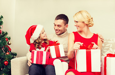 Image showing happy family opening gift boxes