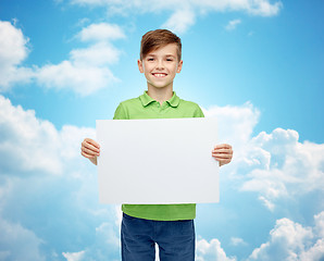 Image showing happy boy in t-shirt holding white blank board