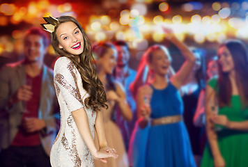 Image showing happy young woman in crown at night club party 