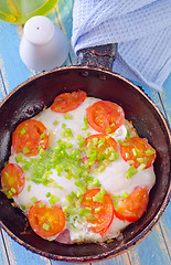 Image showing fried eggs with fresh tomato