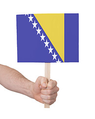 Image showing Hand holding small card - Flag of Bosnia Herzegovina