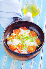 Image showing fried eggs with fresh tomato