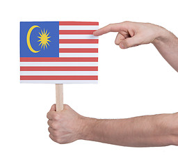 Image showing Hand holding small card - Flag of Malaysia