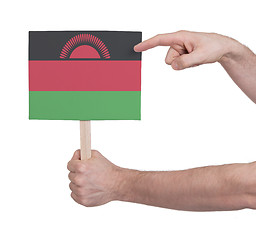 Image showing Hand holding small card - Flag of Malawi