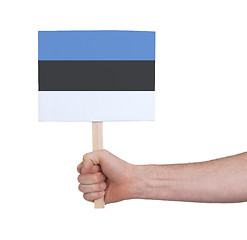 Image showing Hand holding small card - Flag of Estonia