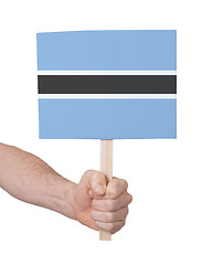 Image showing Hand holding small card - Flag of Botswana