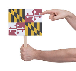 Image showing Hand holding small card - Flag of Maryland