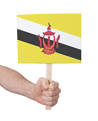 Image showing Hand holding small card - Flag of Brunei