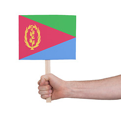 Image showing Hand holding small card - Flag of Eritrea