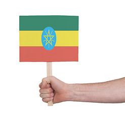 Image showing Hand holding small card - Flag of Ethiopia