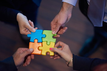 Image showing assembling jigsaw puzzle