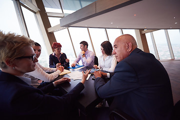 Image showing business people group on meeting at modern bright office