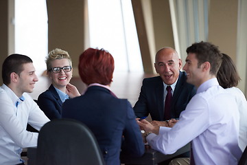 Image showing business people group on meeting at modern bright office