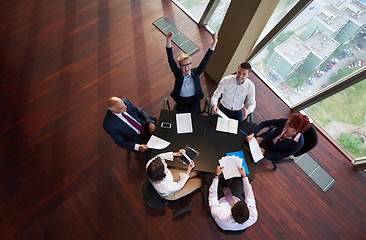 Image showing top view of business people group throwing dociments in air