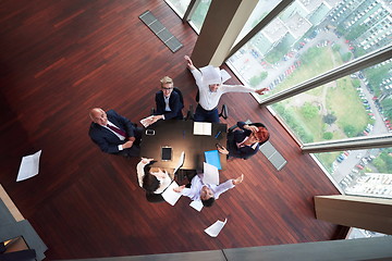 Image showing top view of business people group throwing dociments in air