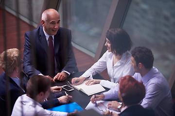 Image showing business people group on meeting at modern bright office