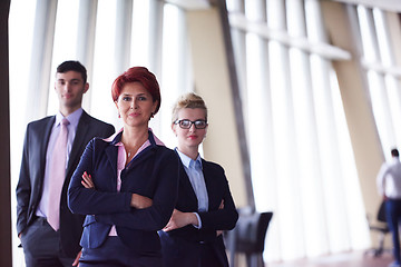 Image showing diverse business people group with redhair  woman in front