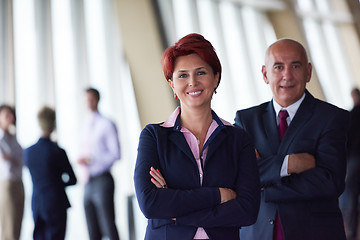 Image showing diverse business people group with redhair  woman in front