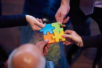 Image showing assembling jigsaw puzzle