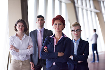 Image showing diverse business people group with redhair  woman in front