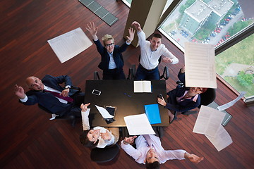 Image showing top view of business people group throwing dociments in air