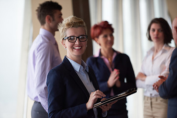 Image showing diverse business people group with blonde  woman in front