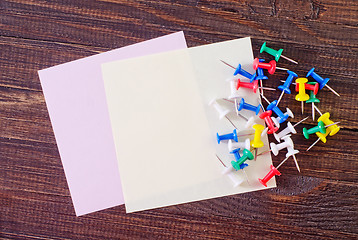 Image showing color paper on wooden background