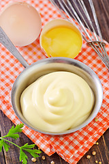 Image showing mayonnaise in metal spoon on wooden board