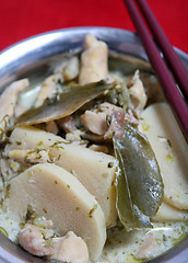 Image showing Thai green curry and chopsticks