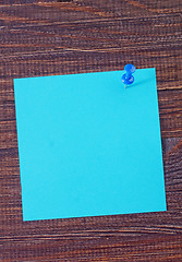 Image showing color paper on wooden background