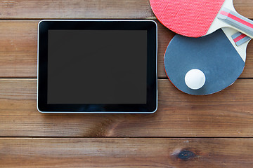 Image showing close up of table tennis rackets and tablet pc