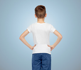 Image showing boy in white t-shirt and jeans from back