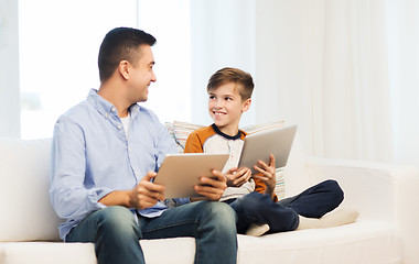 Image showing happy father and son with tablet pc at home