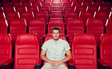 Image showing happy young man watching movie in theater